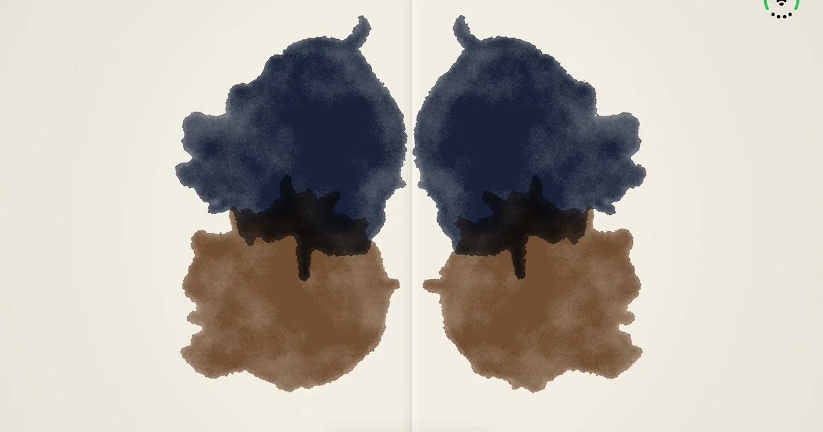 A symmetrical inkblot, blue-black above and sepia below, pressed across two facing pages.