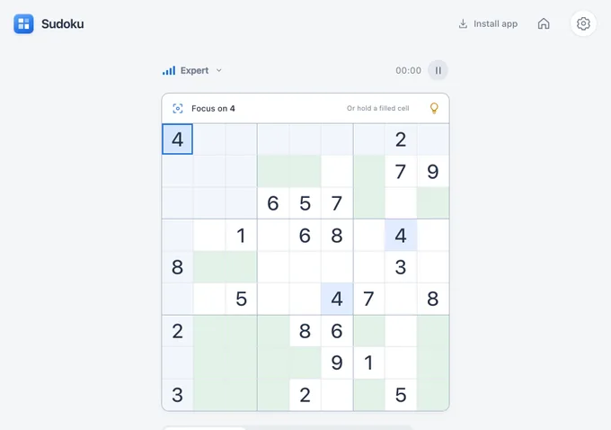 Before: the Sudoku app on the open iPhone Duo in landscape, 890 by 626. The board fills the screen height and the number keys are cut off below it.